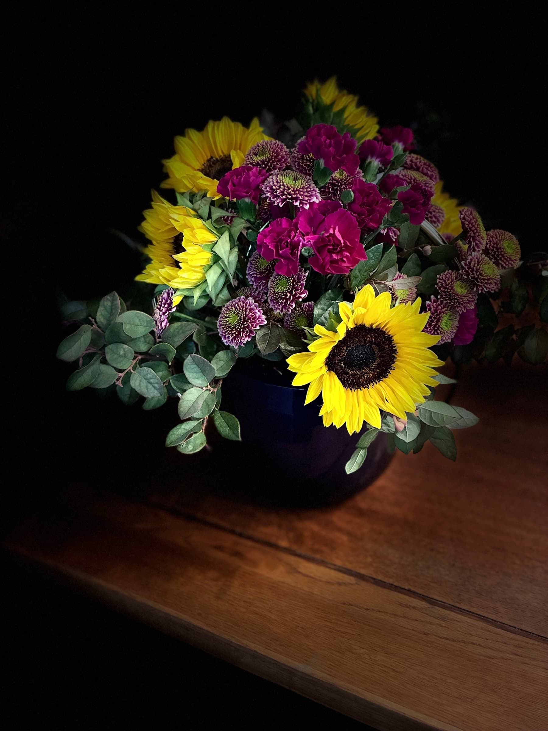 Sunflowers and magenta sweet william in a cobalt vase