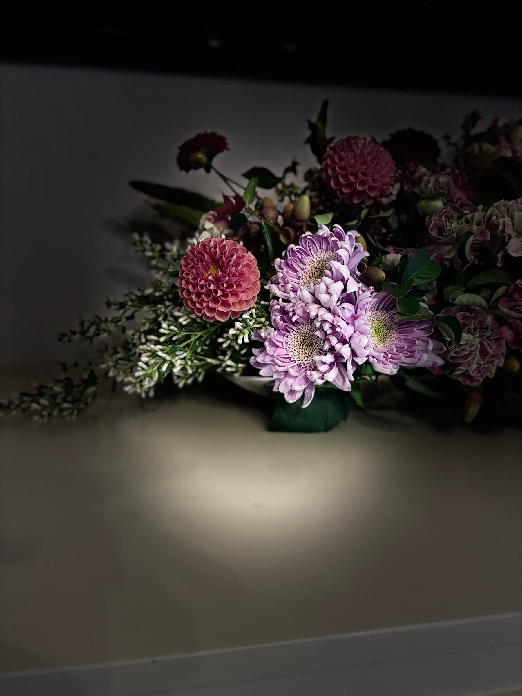 Dahlias and lavender mums in a low arrangement